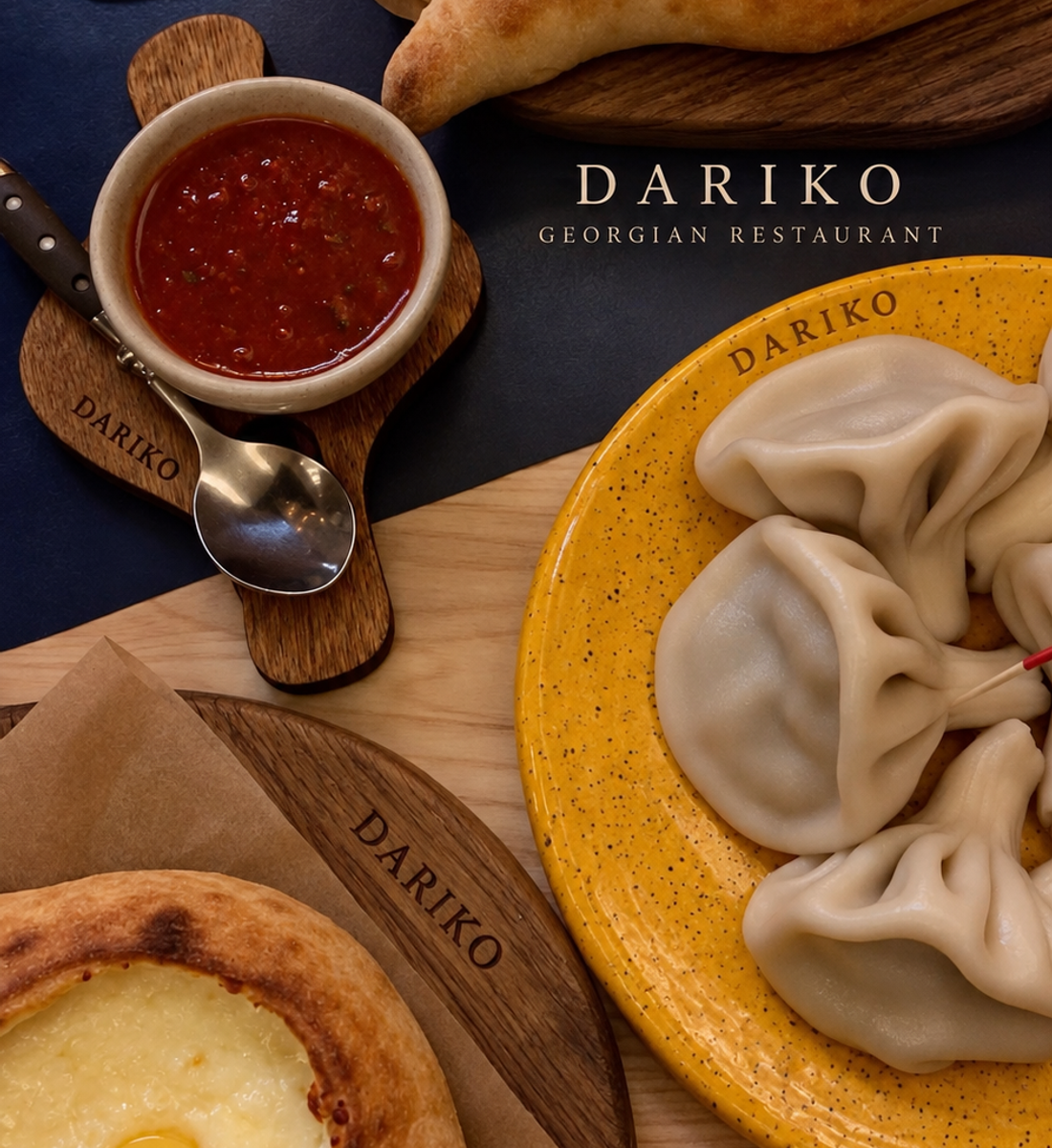 Khinkali and Adjarian khachapuri served on DARIKO tableware